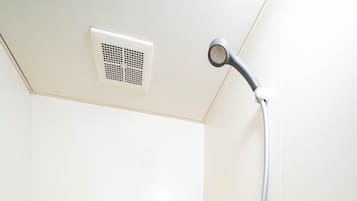 Combined shower/tub, free toiletries, hair dryer, slippers