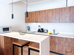 Fridge, microwave, stovetop, coffee/tea maker