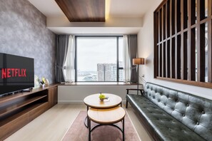 Comfort Apartment | Living area | 43-inch Smart TV with digital channels - The Pinnacle Residence Service by Soben (Phnom Penh)