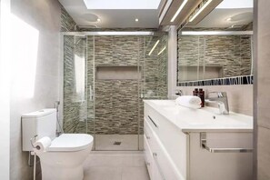 Shower, eco-friendly toiletries, hair dryer, bidet