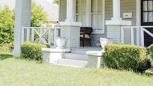 A single-story house with a porch, a front door, and a mailbox. - Minutes from Maxwell AFB, this historic 3BR feels more like home than a rental. Guests love the quiet street, thoughtful touches, and a host who makes every stay easy. (Montgomery)