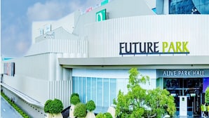 A modern building with 'EUREPARK' signage, a large glass entrance, and a section labeled 'ALIVE PARK HALL'. - THE MOMENT (Khlong Luang)