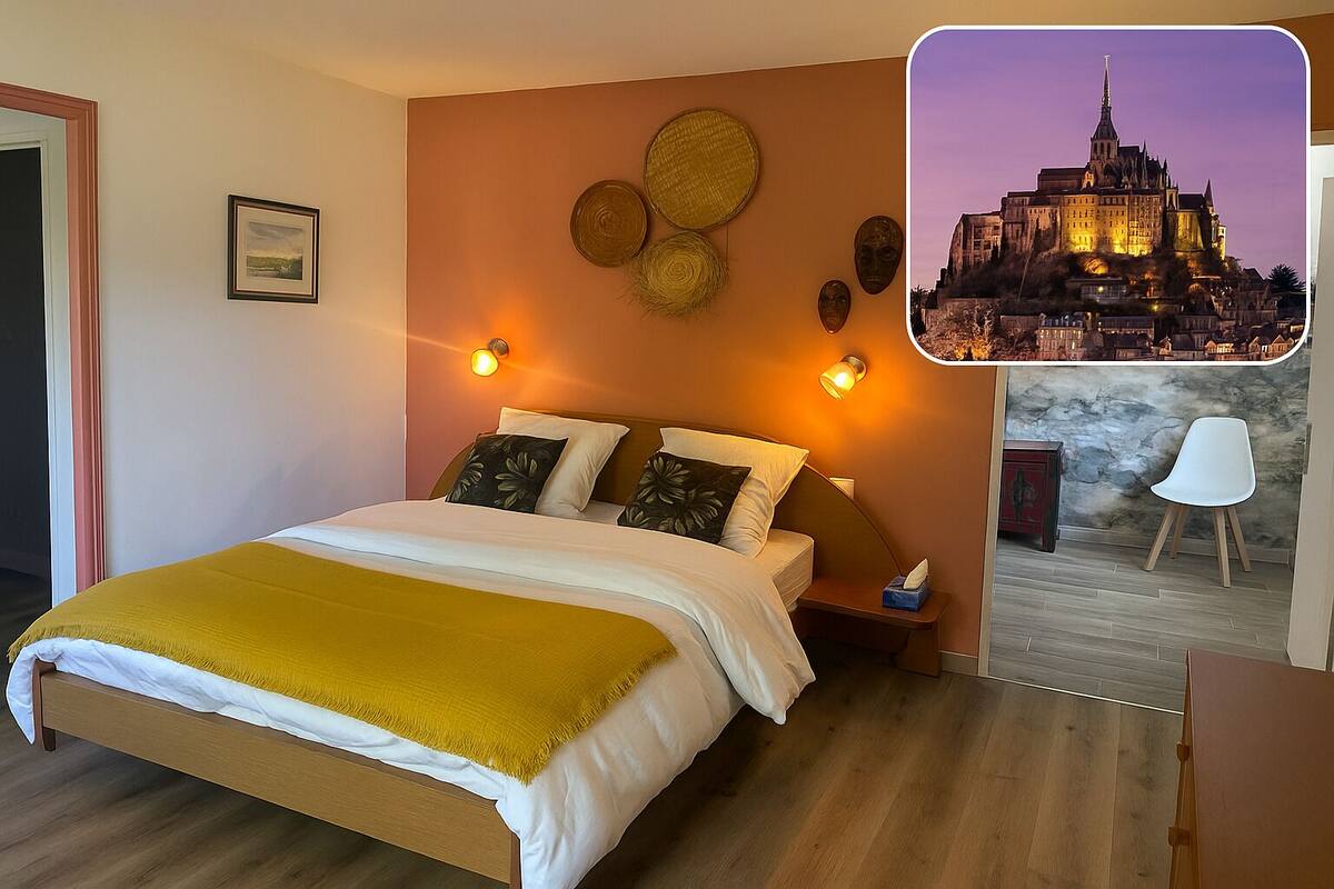 A hotel room with a large bed, two bedside tables, a nightstand, a chair, and a wall with decorative items.