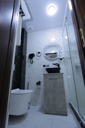 Shower, free toiletries, hair dryer, slippers