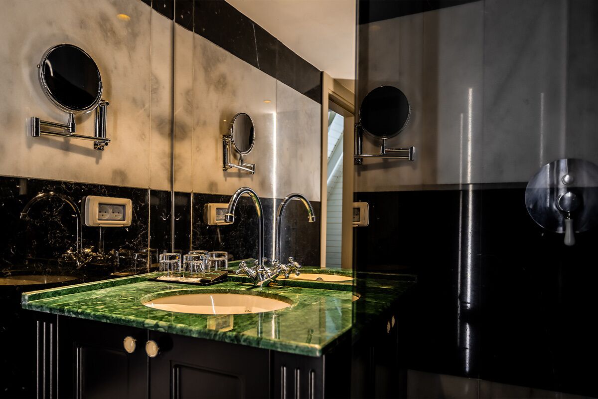 A modern bathroom with two sinks, each with a mirror above.