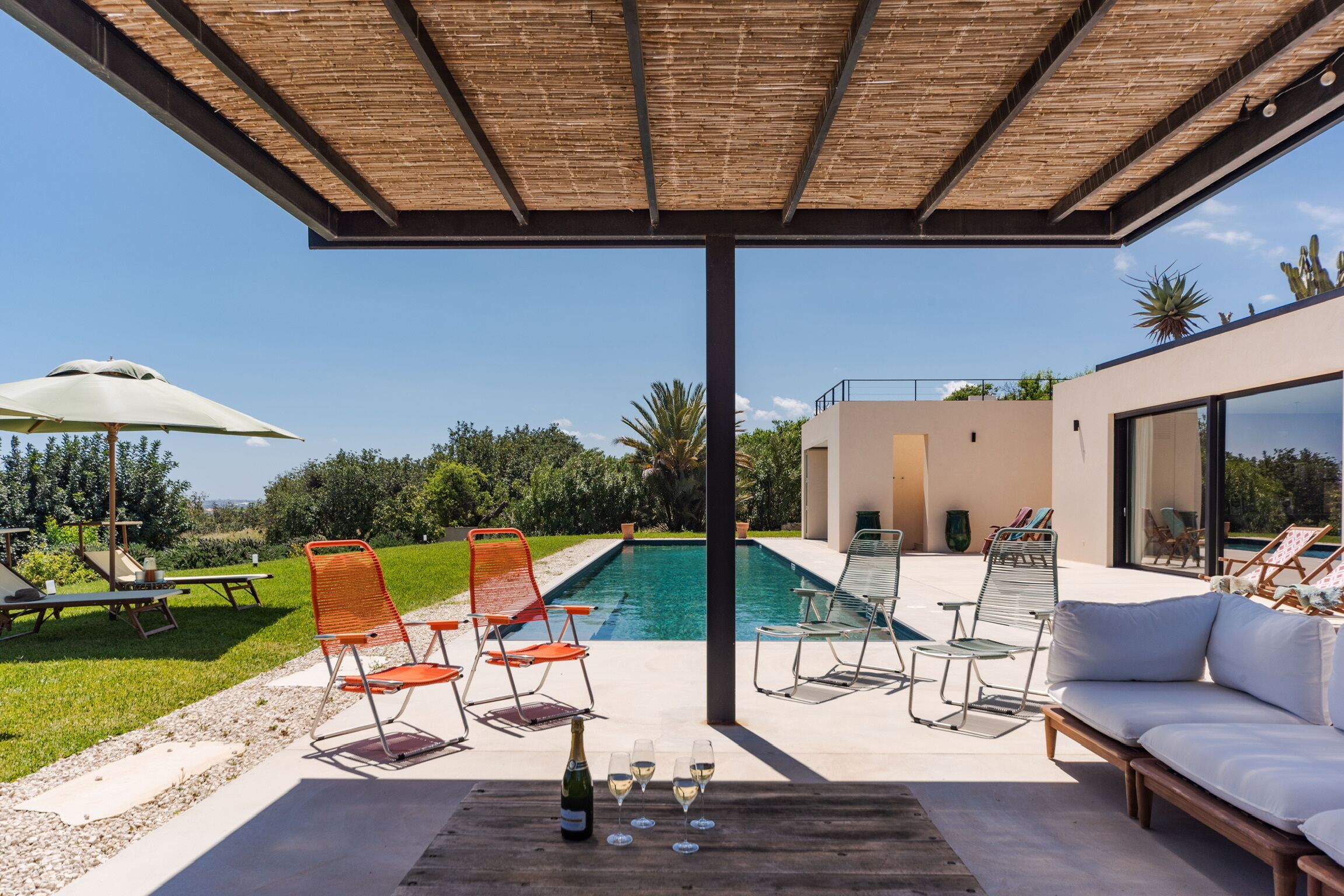 Seasonal outdoor pool, pool umbrellas, pool loungers