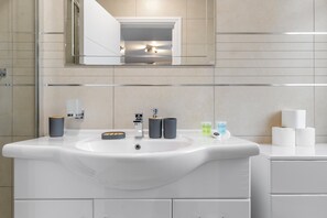 Shower, hair dryer, towels, soap