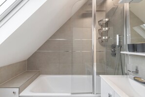 Shower, hair dryer, towels, soap