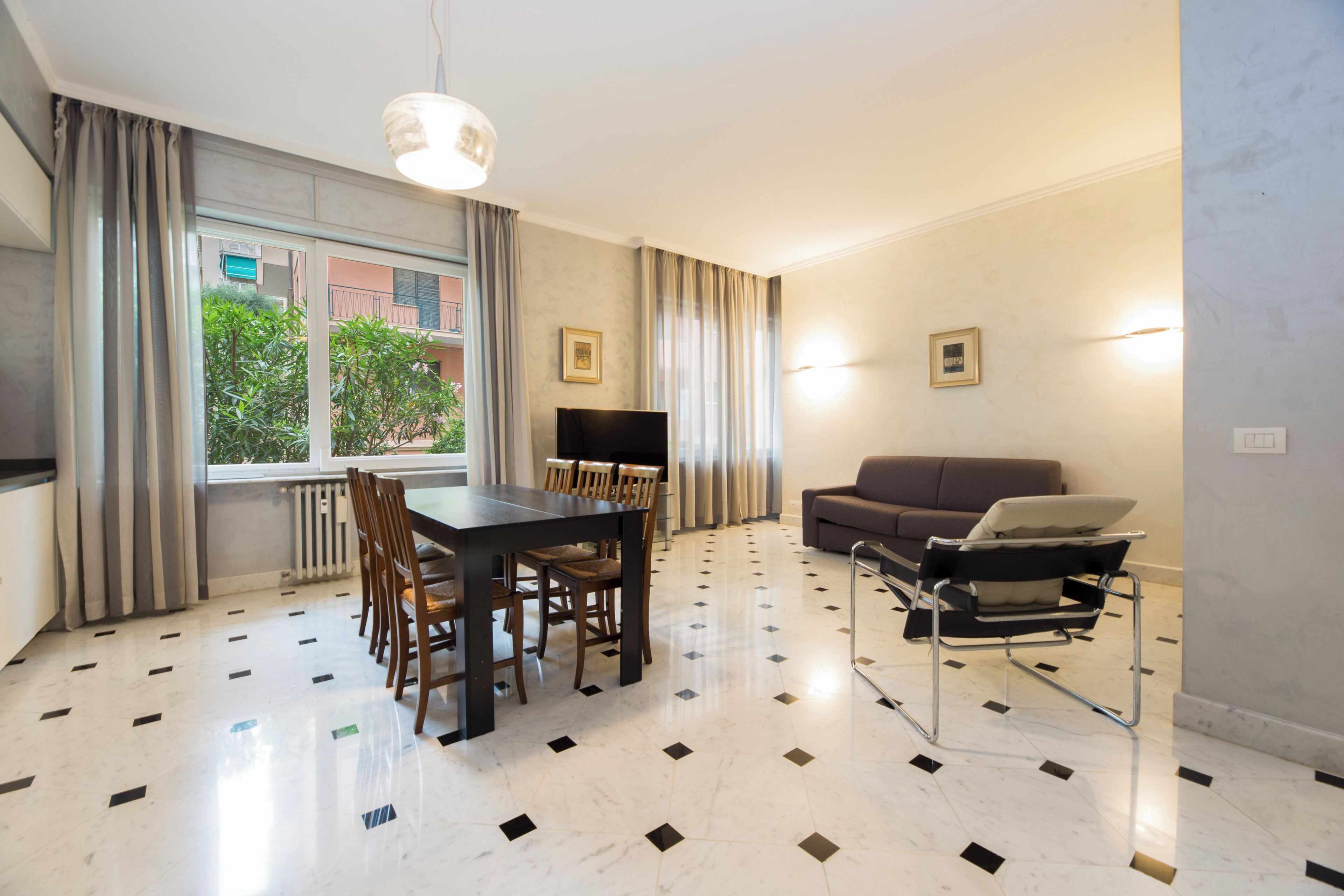 Apartment, 2 Bedrooms, Balcony, Courtyard View | Living area | 32-inch flat-screen TV with cable channels
