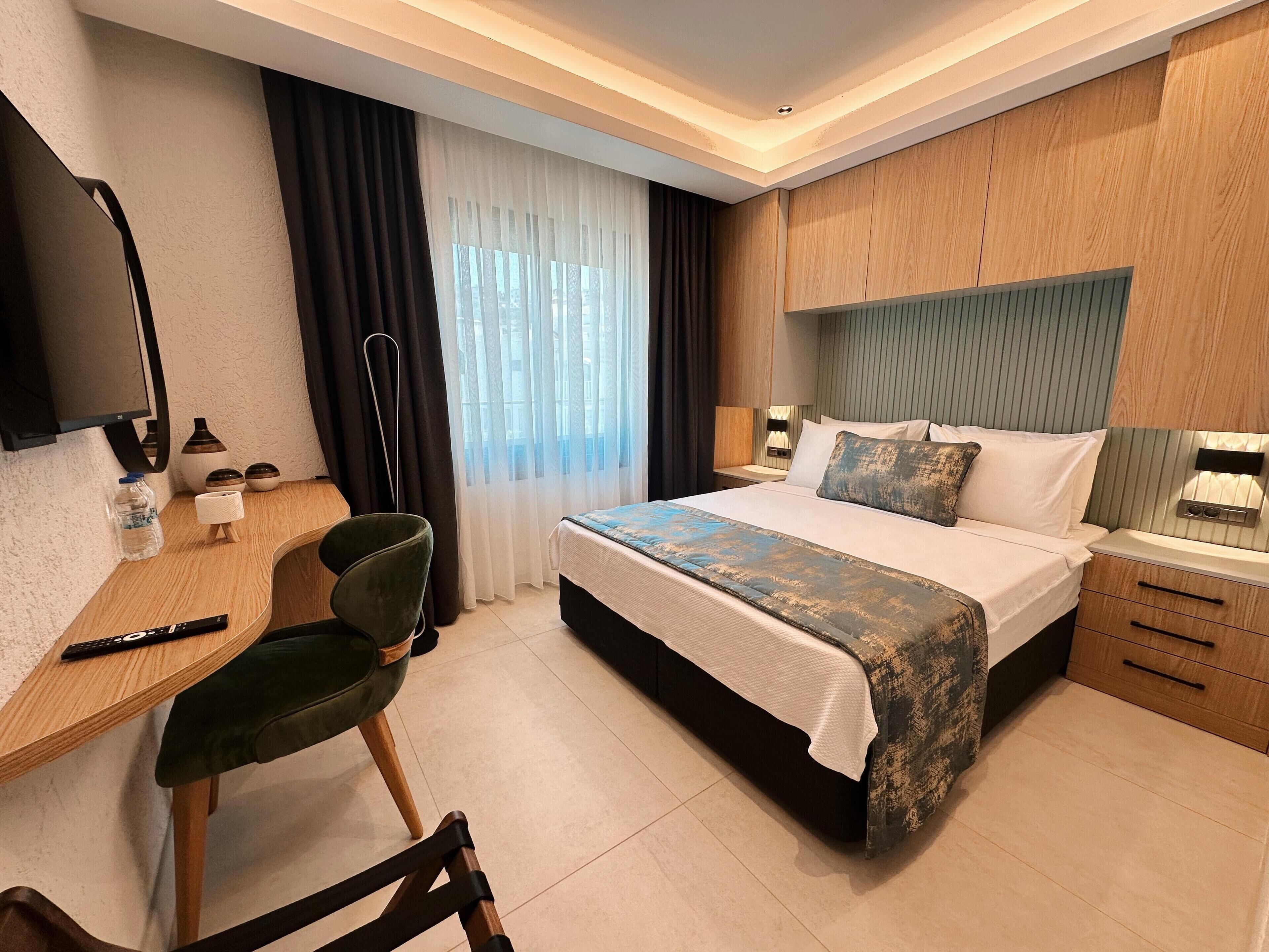 Suite Deluxe, 2 dormitoris, vistes al mar | Roba de llit d'alta qualitat i minibar gratuït 