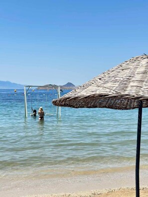 Sun-loungers, beach umbrellas, beach towels
