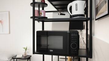 Apartamento, 2 quartos, 2 banheiros | Cozinha privada | Geladeira, micro-ondas, cooktop, cafeteira/chaleira