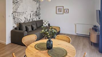 Superior Apartment | Living area | 50-inch Smart TV with cable channels