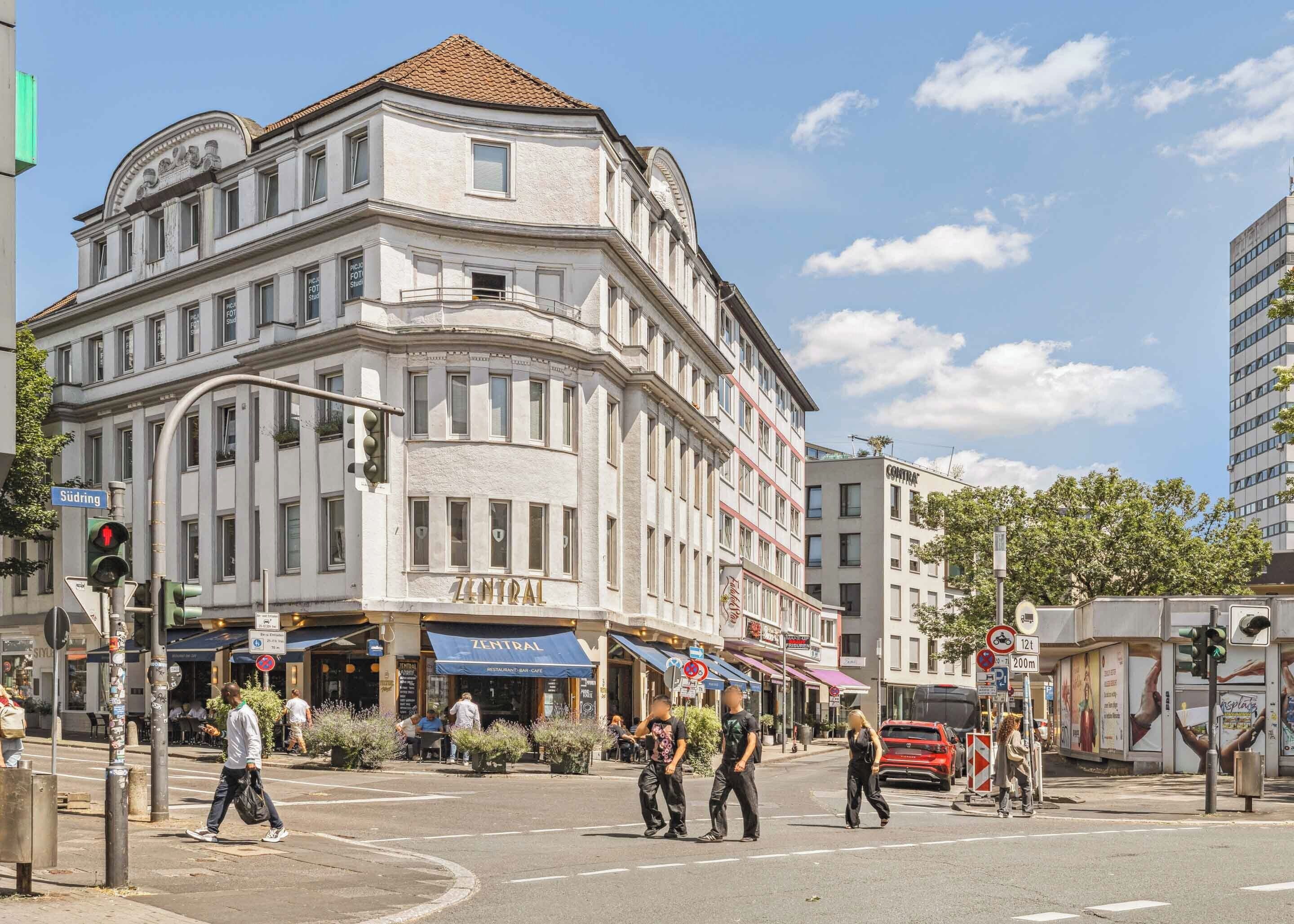 A corner building with a 'Central' restaurant-bar-cafe on the ground floor.