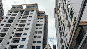 A high-rise building with multiple balconies and windows. - The Snug Haven (Nairobi)
