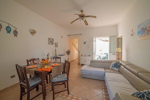 Standard Apartment, Multiple Bedrooms (Rusciu Te Lu Mare Apartment) | Living area | 21-inch TV with cable channels - Rusciu Te Lu Mare Apartment (Porto Cesareo)