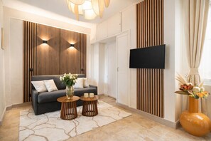 Standard Apartment, Courtyard View | Living area | 80-cm Smart TV with digital channels