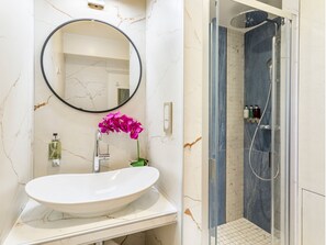 Apartment, Balcony, City View | Bathroom | Hair dryer, towels