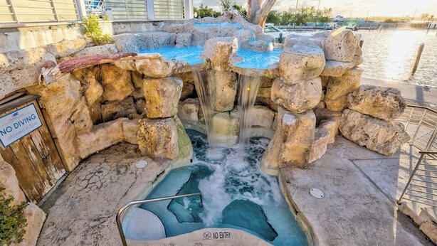 A hot spring area with a sign indicating no diving allowed. - Mariners Club Unit 904, VRNR Luxury Collection, Brand New Completely Remodeled (Key Largo)