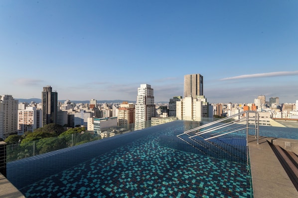 Outdoor pool, pool umbrellas, sun loungers