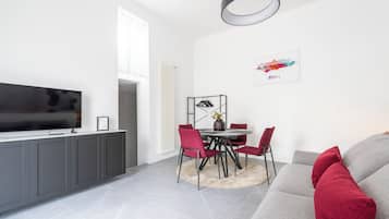 Apartment (1 Bedroom) | Living area | 32-inch Smart TV with cable channels