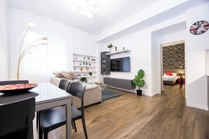 Comfort Apartment, City View | Living area | 43-inch Smart TV with digital channels