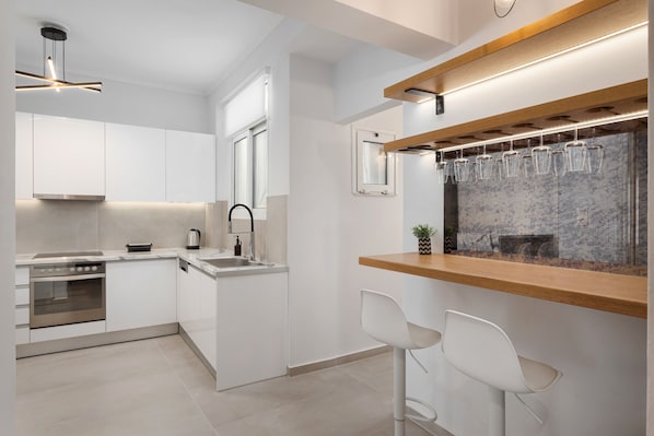 Deluxe Apartment, Balcony | Private kitchen | Full-sized fridge, oven, stovetop, dishwasher