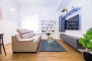 Comfort Apartment, City View | Living area | 43-inch Smart TV with digital channels