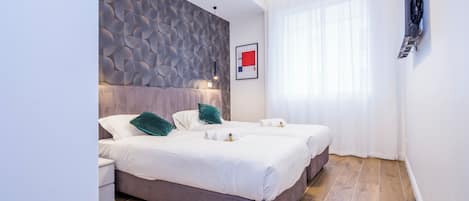 Apartment, 3 Bedrooms, 2 Bathrooms | Laptop workspace, iron/ironing board, free WiFi, bed sheets