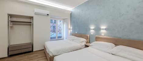Deluxe Quadruple Room, City View | Desk, free WiFi