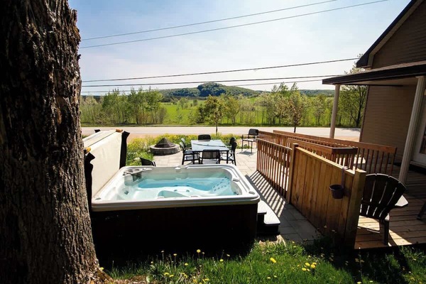 Relax in the private hot tub surrounded by the tranquility of nature.