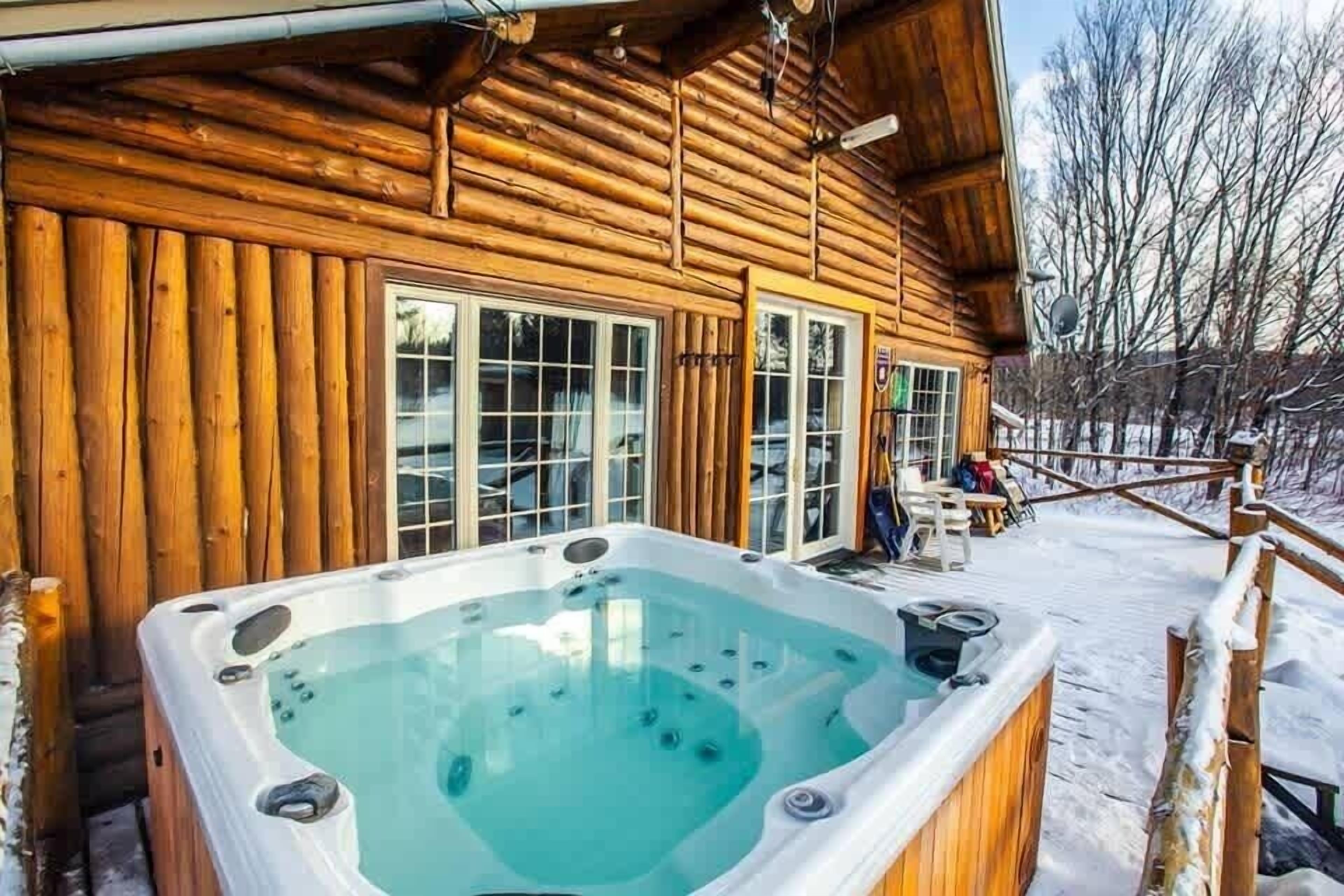 The cabin’s peaceful surroundings captured in a snow-covered view.