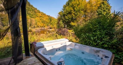 Tranquil Riverfront Chalet with Hot Tub & Kayaks