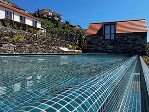 Outdoor pool, open 8:00 AM to 9:00 PM, pool loungers