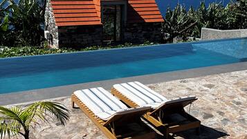Outdoor pool, open 8:00 AM to 9:00 PM, sun loungers