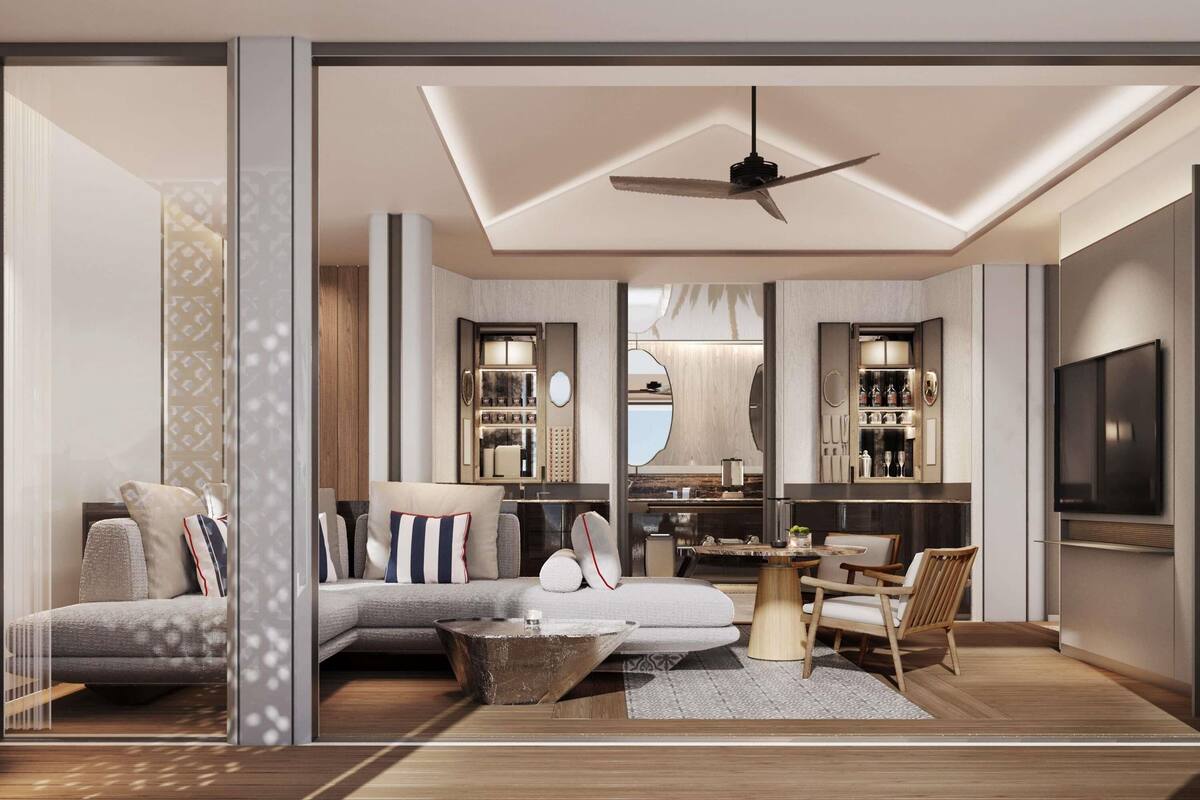 A modern living room with a sofa, coffee table, and TV.