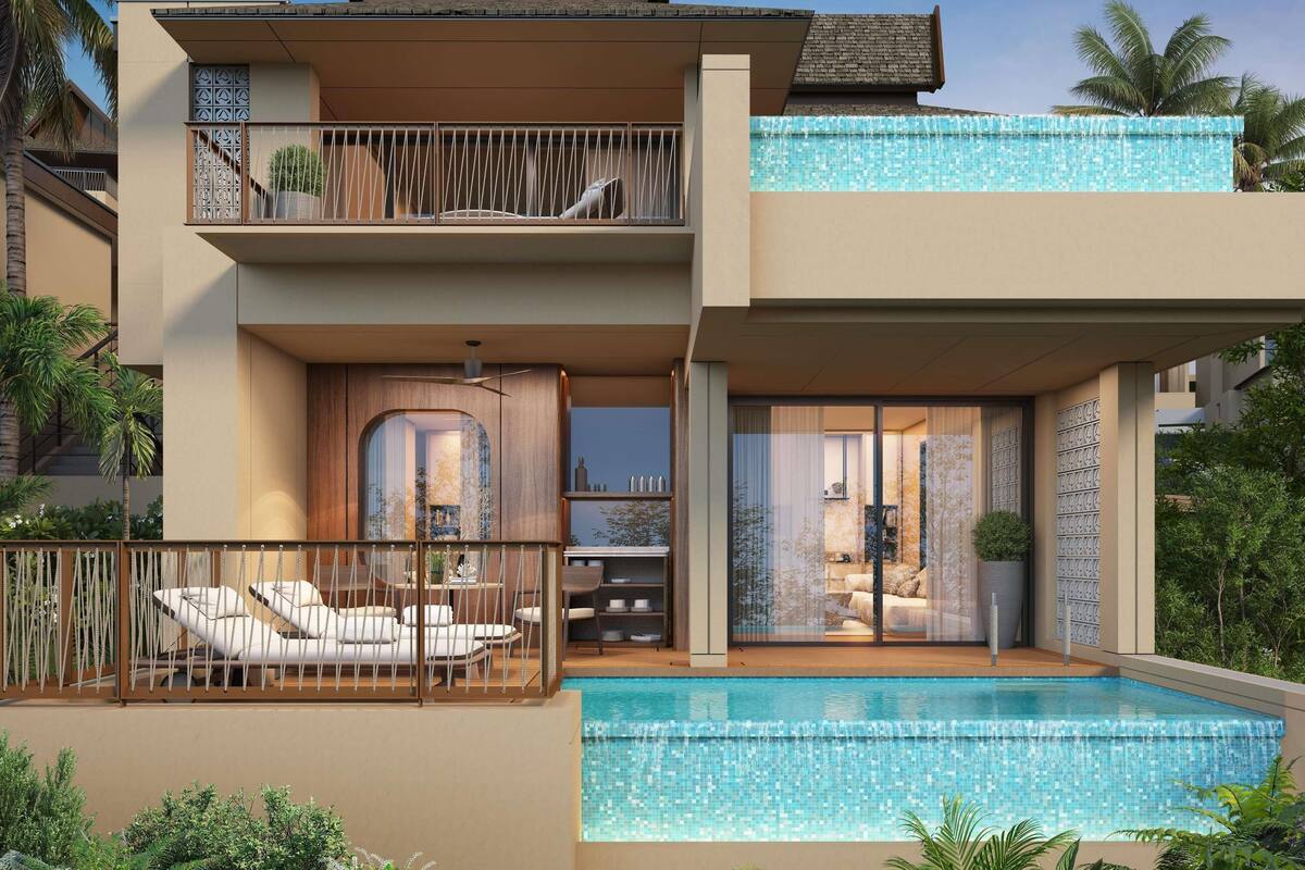A two-story house with a swimming pool, outdoor seating, and a balcony.
