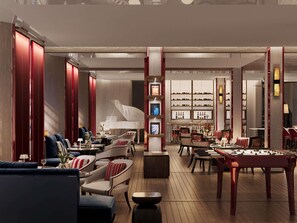 A spacious lounge area with a grand piano, comfortable seating, and a bar with shelves of bottles. - Navera Phuket - Mgallery Collection (Choeng Thale)