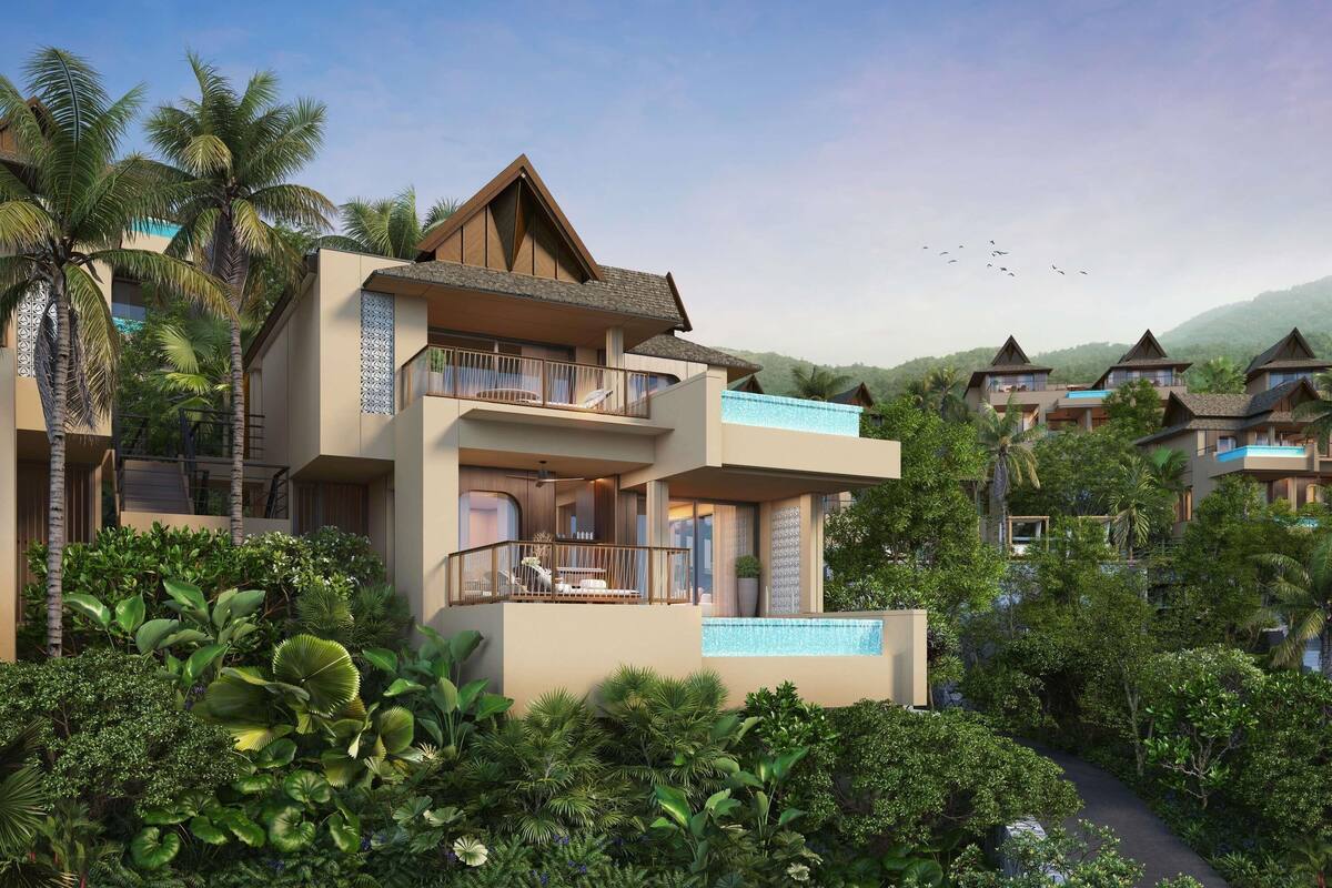 A modern resort building with multiple balconies, a swimming pool, and lush tropical vegetation.