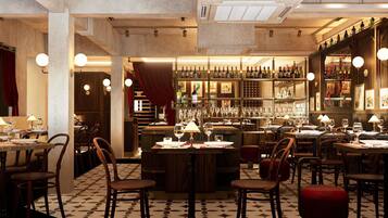 A restaurant with a bar area, tables, chairs, and a patterned floor.