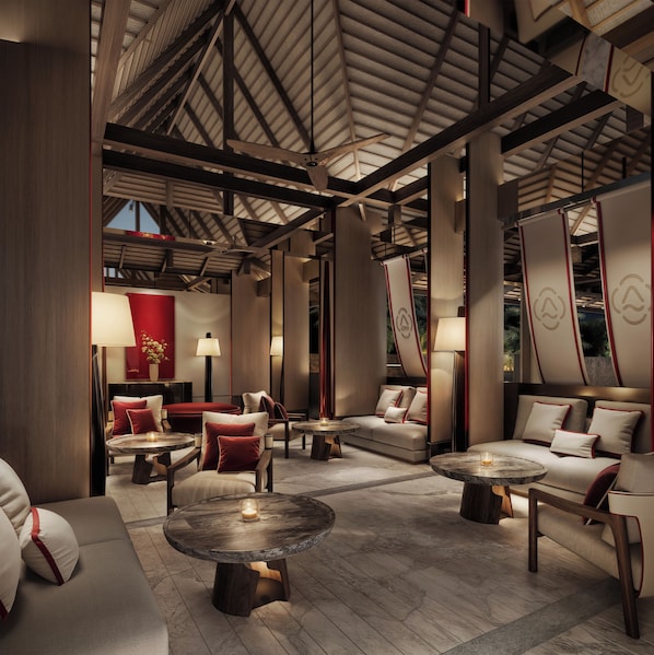 A spacious lobby with high ceilings, wooden beams, and a variety of seating arrangements including sofas and round tables. - Navera Phuket - Mgallery Collection (Choeng Thale)