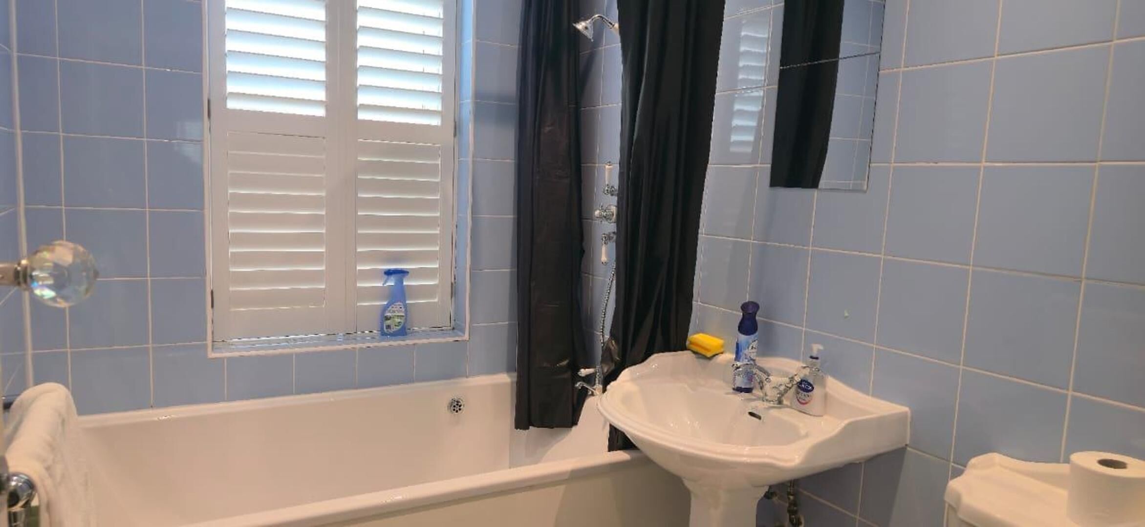 Separate bathtub and shower, deep-soaking bathtub, hair dryer, towels