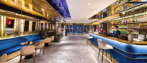 A bar area with seating and a bar counter.