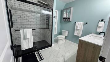 Shower, hair dryer, towels, soap
