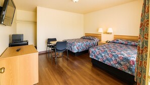 A hotel room with two beds, a desk, a chair, a television, and a telephone. - Budget Motel Granite City/St Louis Area (Granite City)