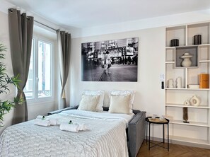 Deluxe Apartment, Courtyard View | Living area | 80-cm Smart TV with digital channels