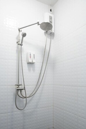 Shower, hair dryer, towels, toilet paper