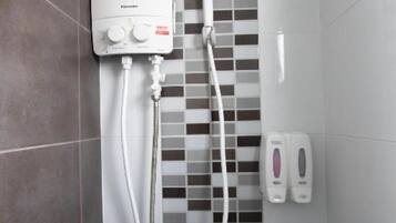 Shower, hair dryer, towels, toilet paper