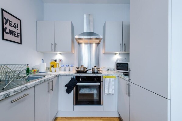 Fridge, microwave, toaster, cookware/dishes/utensils
