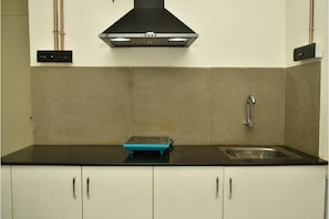 Fridge, microwave, stovetop, electric kettle - Fully Furnished Boutique Apartment with kitchen (Chennai)